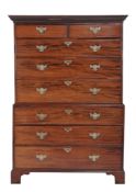 A George III mahogany chest-on-chest,   circa 1780, the carved scroll, dentil, and accanthus