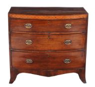 A Regency mahogany chest of drawers,   circa 1815, of bowfront outline, the cross-banded caddy top