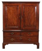 A George III mahogany clothes press  , circa 1760, the moulded cornice above a pair of panelled
