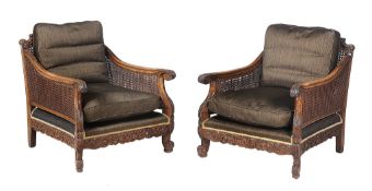 A beech three-piece bergere suite  , early 20th century, comprising a pair of arm chairs and a