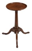 A George III walnut kettle stand  , circa 1770, the circular dish top above turned stem and