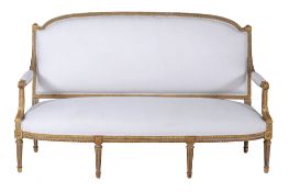 A green painted and parcel gilt framed sofa in Louis XVI style  , 20th century, upholstered in