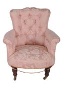 An upholstered armchair in the manner of Howard  &  Sons  , late 19th century, the button