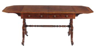 A George IV mahogany sofa table  , circa 1825, the banded rectangular top with canted corners above