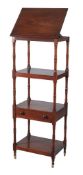 A George IV mahogany four tier whatnot  , circa 1825, the hinged ratchet adjustable top with rest