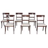 A set of six Regency mahogany dining chairs,   circa 1815, each string inlaid bar back above