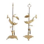 A pair of brass adjustable students' lamps in 19th century style,   20th century, each with an oil