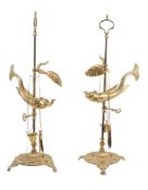 A pair of brass adjustable students' lamps in 19th century style,   20th century, each with an oil
