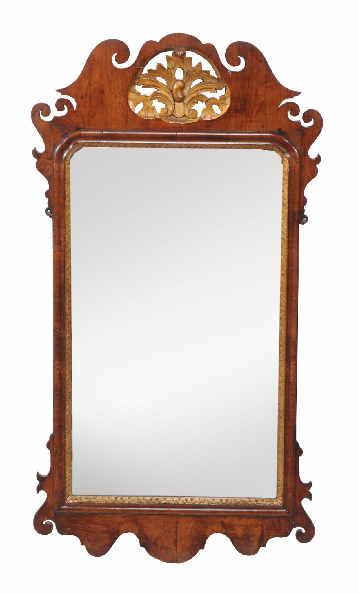 A George II mahogany and parcel gilt fretwork wall mirror,   circa 1740, the rectangular mirror-