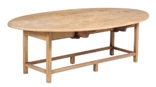 A light oak wake table, in mid 18th century style,   20th century,  the oval top with shallow drop