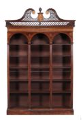 A mahogany and marquetry inlaid open bookcase  , circa 1900, the swan neck cornice, 19th century,