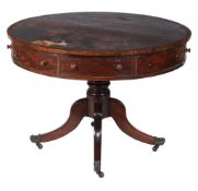 A George IV mahogany drum library table  , circa 1825, the tooled leather inset top above four