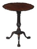 A George III mahogany tripod table , circa 1790, the piecrust top above a fluted stem and wrythen