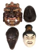 A collection of approximately thirty facial masks  , including African and Asian examples, 20th
