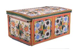 A Scandinavian carved and polychrome painted pine coffer,   late 19th century, the hinged cover,