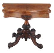 A Victorian walnut card table  , circa 1860, of serpentine outline, the top opening and revolving