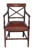 A Regency mahogany elbow chair  , circa 1815, the tablet back above x-splat, open arms, over