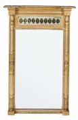 A Regency giltwood pier mirror  , circa 1815, the moulded cornice and beading above a reverse