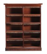 A Victorian mahogany open bookcase  , circa 1860, the moulded outset cornice above two banks of