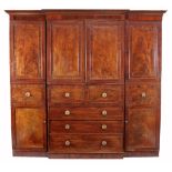 A George III  secretaire  compactum wardrobe,   circa 1800, of breakfront outline, the moulded