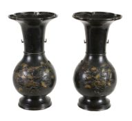 A pair of Japanese bronze vases, Meiji Period  , with gilded details to the flowers, 39cm high