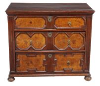 A Charles II oak and walnut chest of drawers  , circa 1670, the rectangular top with moulded edge