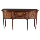 A George III mahogany breakfront sideboard  , circa 1790, the central frieze drawer above a drawer
