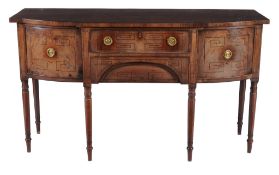 A George III mahogany breakfront sideboard  , circa 1790, the central frieze drawer above a drawer