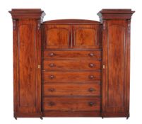 A Victorian mahogany compactum wardrobe  , circa 1880, of breakfront outline, the central chest