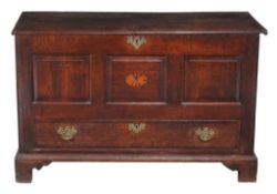 A George III oak mule chest  , circa 1770, the lift top opening to fitted candlebox and large