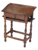 An oak scribe's desk  , early 18th century, with fixed writing slope above single drawer with later