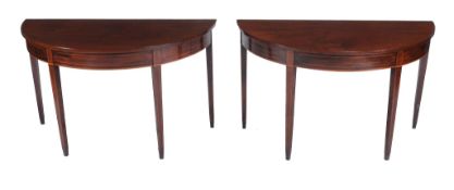 A pair of George III mahogany demi-lune side tables,   circa 1800, each D-end top above a