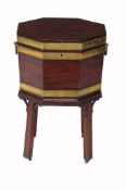A George III mahogany and brass bound octagonal wine cooler  , circa 1780, the hinged lid flanked