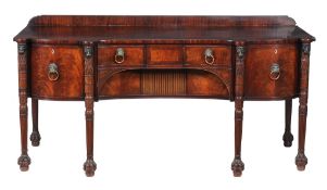 A George III mahogany sideboard,   circa 1800, the shaped front with central drawer above a deep