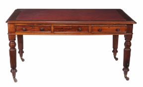 A Victorian mahogany writing table,   circa 1870, the rectangular top with rounded corners and
