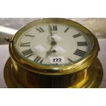 A brass ships clock,   the dial with Roman numerals and subsidiary seconds dial, 26cm