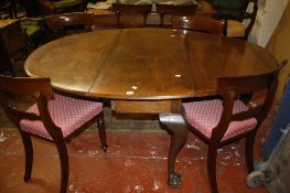 A mahogany oval dropleaf dining table  , in George III style, on cabriole legs with ball and claw