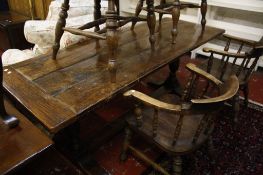 An oak refectory table   with cleated ends on baluster turned legs and splayed feet 200cm length