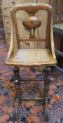 A Victorian adjustable sprung secretary's chair   with a cane seat.