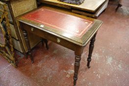 A Victorian oak two drawer side table   with red leather inset top