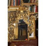 An Indian gilt and jewelled mirror  , elements detached