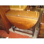 A mahogany oval top gateleg table   on turned supports 90cm wide