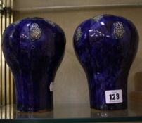 A pair of Royal Doulton stoneware vases,   blue ground, floral decorated, marked LP, no. 8254, 17cm