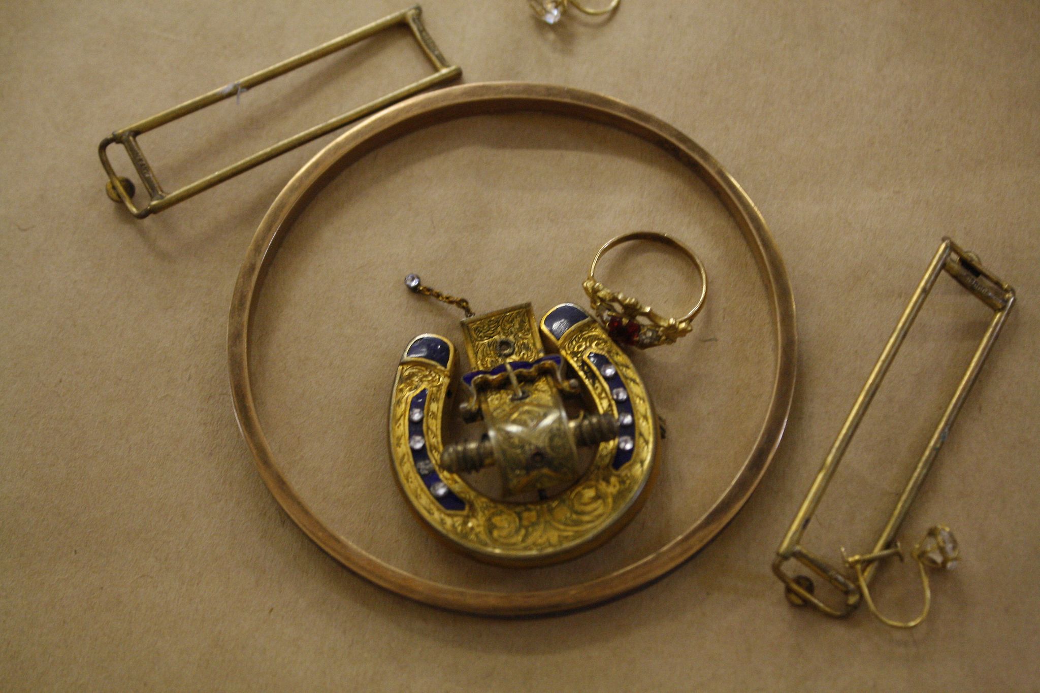 A pair of 9ct gold earrings,   a gold coloured and inlaid bangle, a gold coloured ring, a buckle