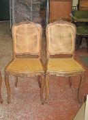 A set of six walnut and carved cane chairs   in Louis XV style
