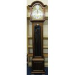 A mahogany longcase clock   with an arched brass and silvered dial, with Roman and numeral numbers,