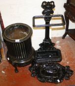 A painted cast iron stick stand   with urn and column support, a bootscraper and mahogany