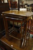 A nest of three Edwardian mahogany tables   with rosewood banding
