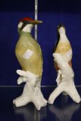 A pair of German porcelain models of woodpeckers  , 24cm high