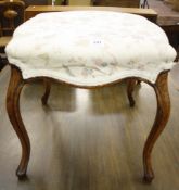 An upholstered stool on cabriole legs   50cm wide